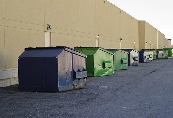 a row of construction dumpsters parked on a jobsite in Elk Grove